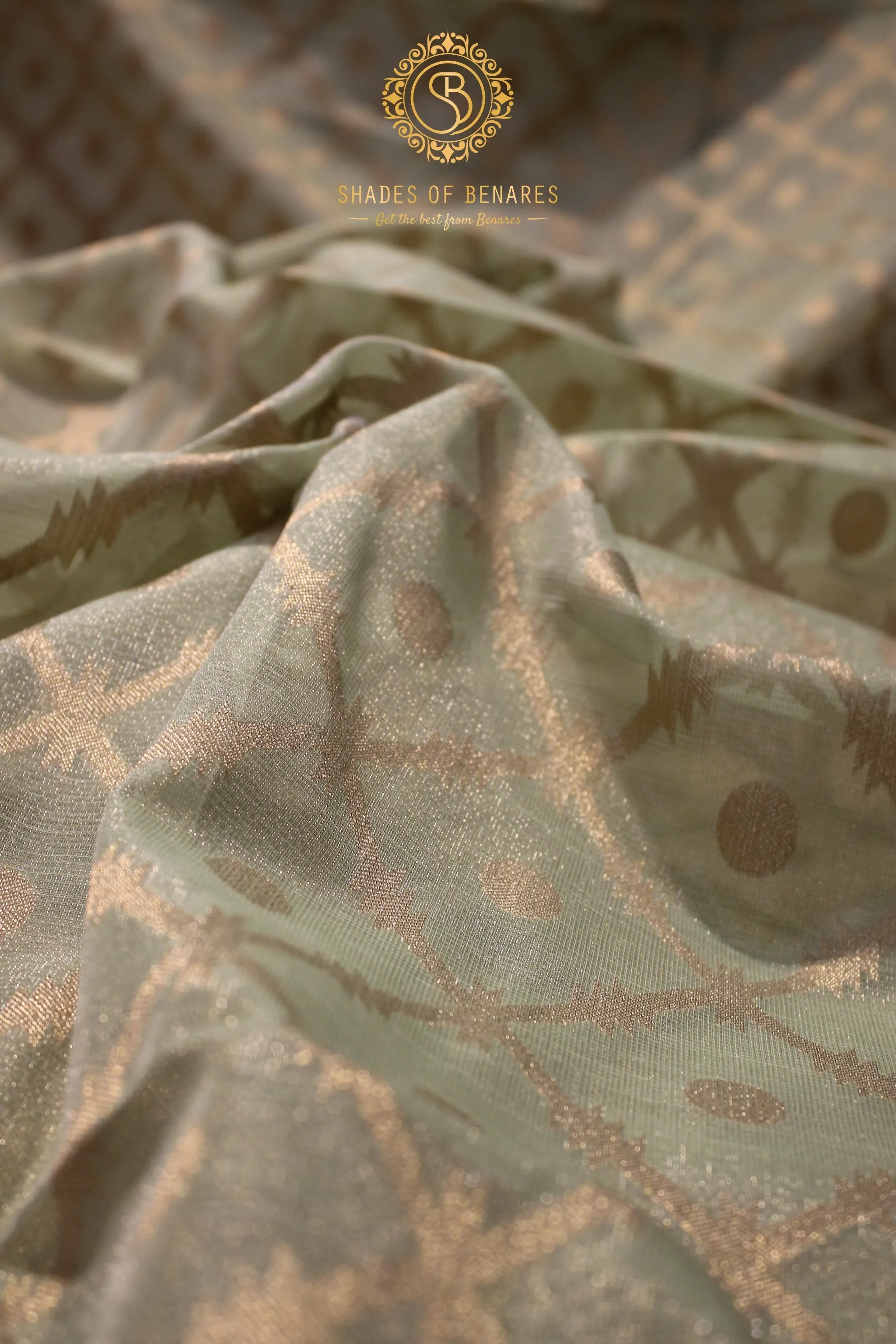 Elegance of Pastel Green Pure Tissue Silk Saree with Gold Jaal Work
