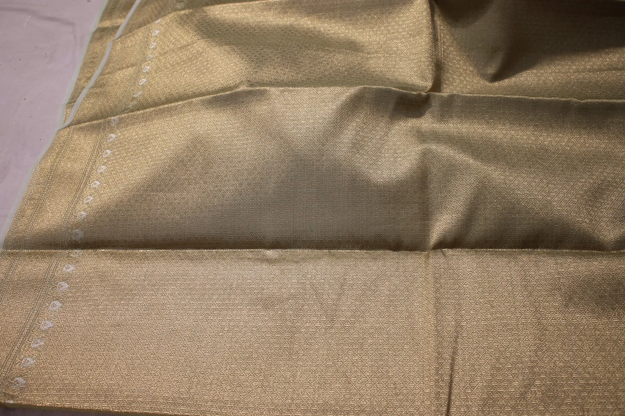 Elegance of Pastel Green Pure Tissue Silk Saree with Gold Jaal Work