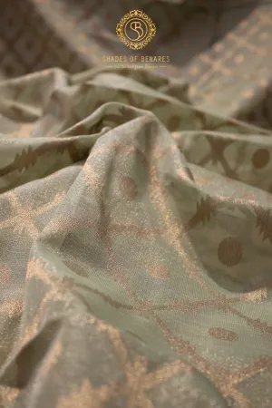 Elegance of Pastel Green Pure Tissue Silk Saree with Gold Jaal Work
